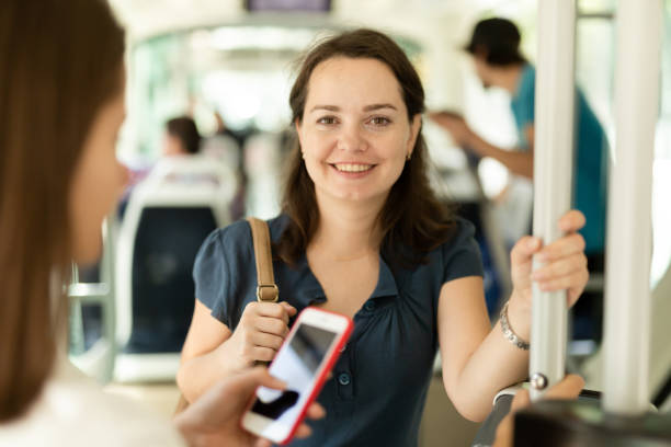 istock Smiling brunette in public transport 1371975358