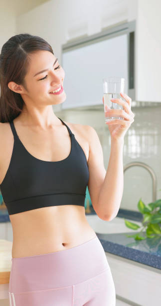 istock woman drink water 1371976938