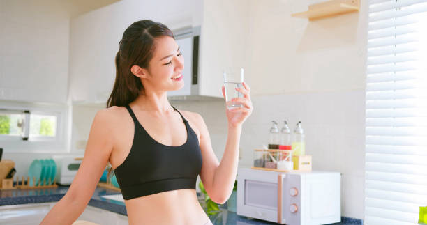 istock woman drinking water 1371977038