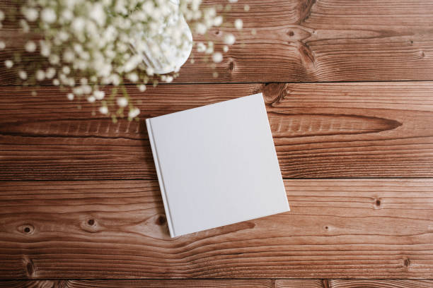istock hardcover white book mock up on wooden table 1371977074