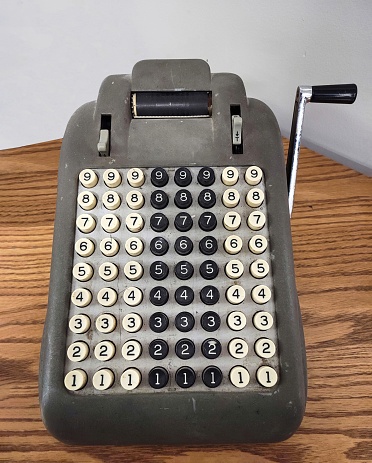 close up of the keyboard of an antique cash register, on retail display for sale at a junkyard, Long Island, New York