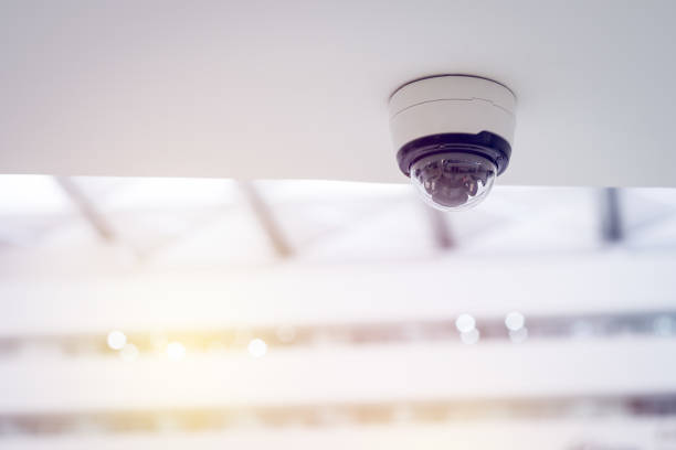 istock Security CCTV camera on white ceiling, Intelligent cameras, Video recording, Anti-theft system, Surveillance. 1371978984