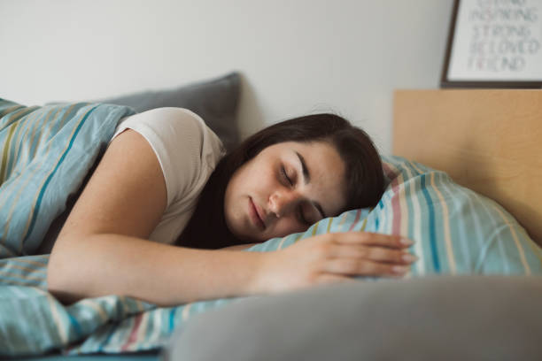 istock Woman resting in bed with sore throat 1371979033