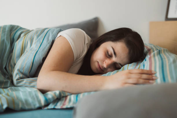 istock Woman resting in bed with sore throat 1371979036