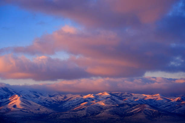 istock Sunrise or Sunset Sunlight on Snowy Mountains Pink Light 1371980035