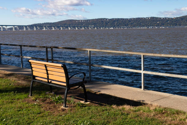 istock Empty Bench along the Hudson River at Devries Park in Sleepy Hollow New York 1371980092