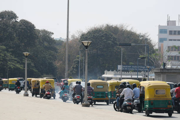 Bangalore Traffic Bangalore or Bengaluru, Karnataka, India - February 5 2022: Selective focus of traffic of vehicles at a signal. signs and symbols stock pictures, royalty-free photos & images