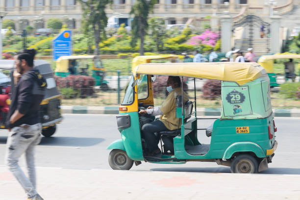 Panning Shot Bangalore or Bengaluru, Karnataka, India - February 5 2022: A selective focus of panning shot of an auto rickshaw. signs and symbols stock pictures, royalty-free photos & images