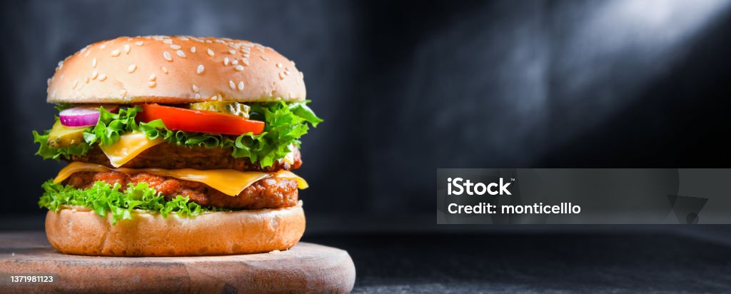 Hamburger with cheese and fresh vegetables Hamburger with cheese and fresh vegetables. Burger Stock Photo