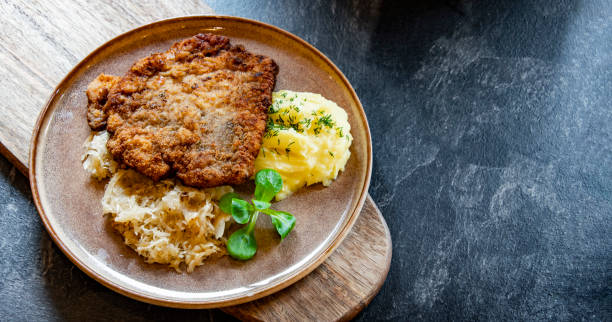 istock Pork breaded cutlet coated with breadcrumbs with mashed potatoes 1371981286
