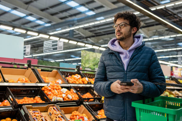 istock Staying Connected at the Supermarket 1371981322