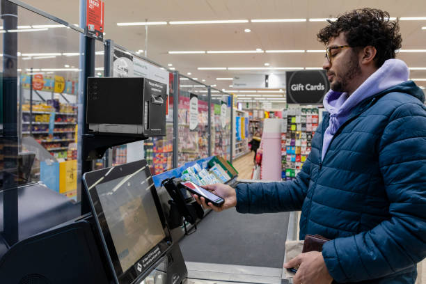 istock Paying Contactless at Self Service Checkout 1371981367