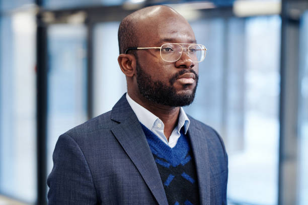 istock African businessman standing at office 1371981483