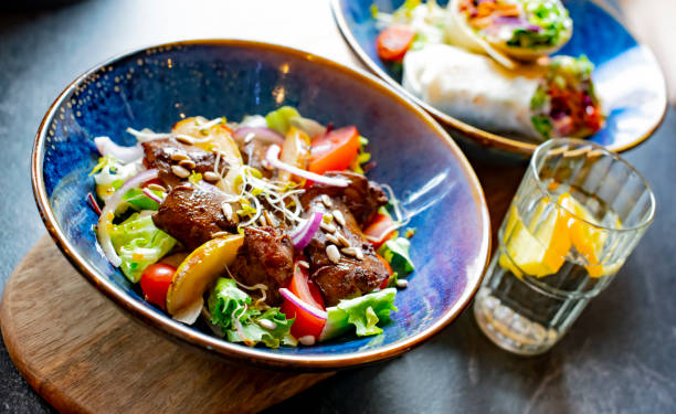 istock Vegetable salad with cooked pork and tortilla 1371981506