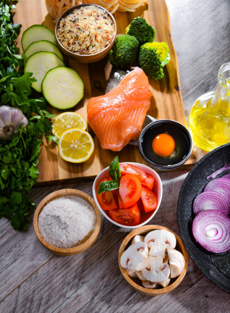 istock Fresh food ingredients prepared for cooking on a kitchen table 1371983686