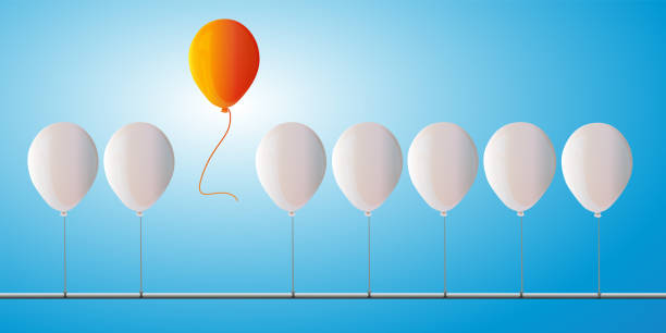 istock Concept of freedom and a balloon that flies away from the crowd. 1371985561