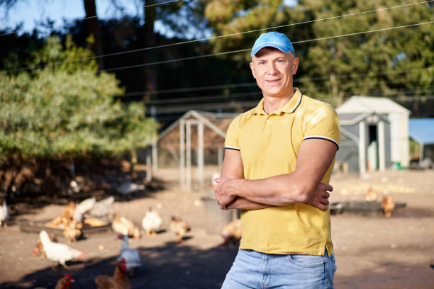 istock male farmer on chicken farm 1371988202