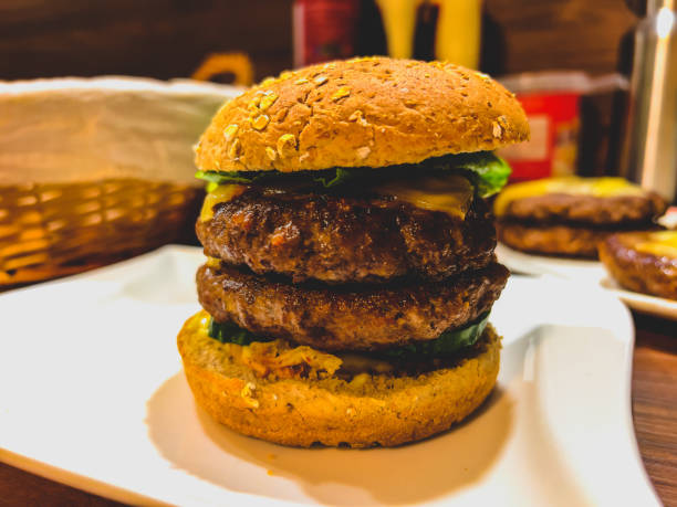 istock A homemade cheeseburger with two meats on one plate. 1371988346