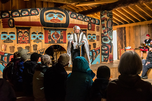 Guide discusses Tlingit heritage at the Jilkaat Kwaan Heritage Center at Klukwan near Haines, Alaska, USA.