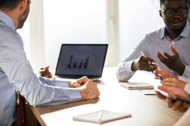 istock Business people gesturing and discussing data during a meeting 1371989091