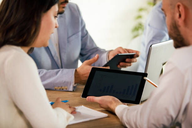 istock Two business colleagues reviewing a graph on digital tablet during a meeting 1371989132