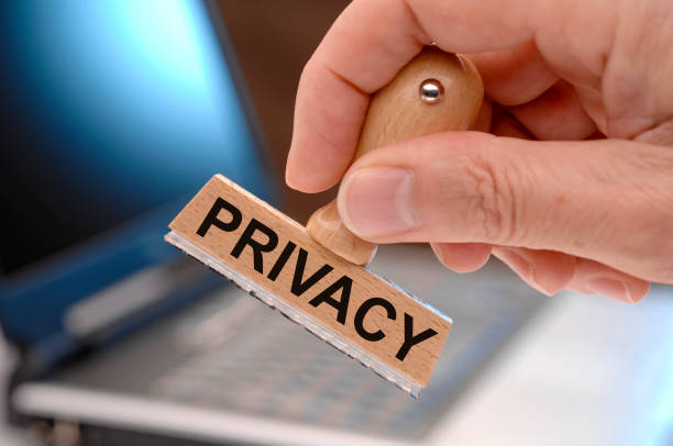 istock privacy printed on rubber stamp in hand 1371990033