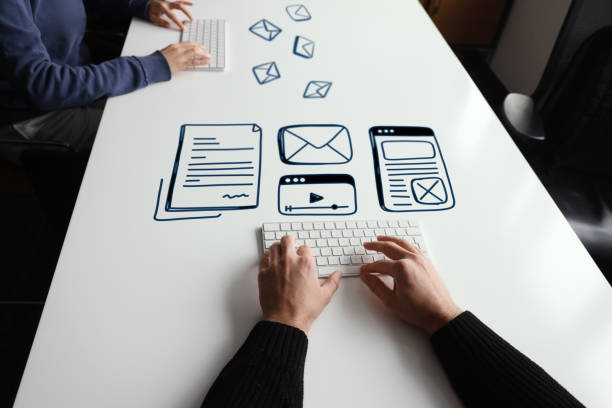 istock People trying to create digital content with line icons on their computer 1371990300