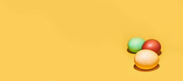 istock Banner with painted Easter eggs on a yellow background. Orthodox Easter with a space to copy 1371990586