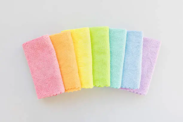 Photo of New microfiber cloth for cleaning and dusting. Seven rainbow colors. Top view