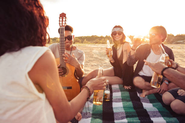 istock Young group of friends outdoors on the beach 1371993060