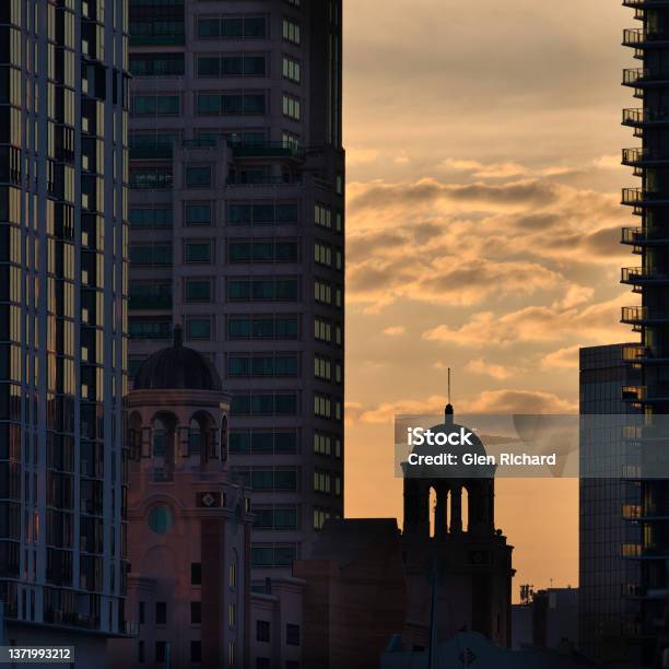 Sunset Between The Hirises Stock Photo - Download Image Now - Apartment, Arch - Architectural Feature, Architectural Feature