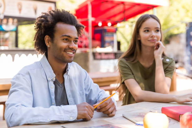 istock Cheerful young multiethnic group of friends students talking 1371994478