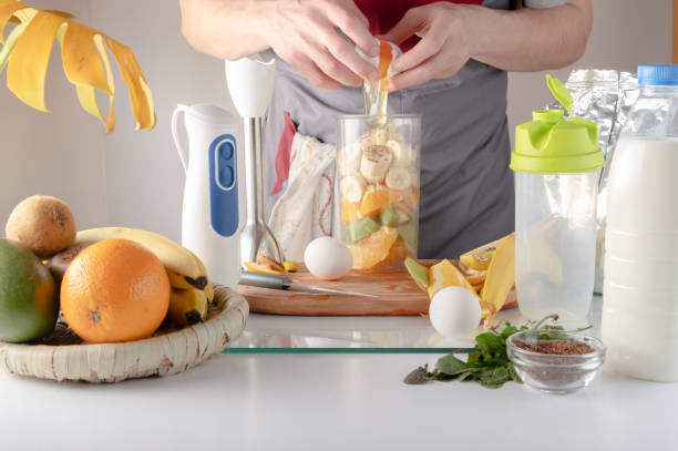 istock Adding chicken protein to a shake. Protein for a sports shake. Protein shake at home. Separate the white from the yolk. 1371995498