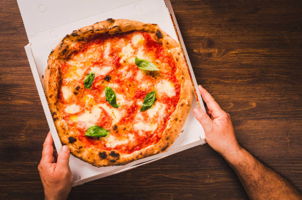 istock Italian pizza Margherita on wood background copy space. 1371995689