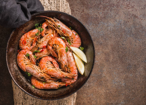 istock Red shrimps cooked in pan. 1371995742