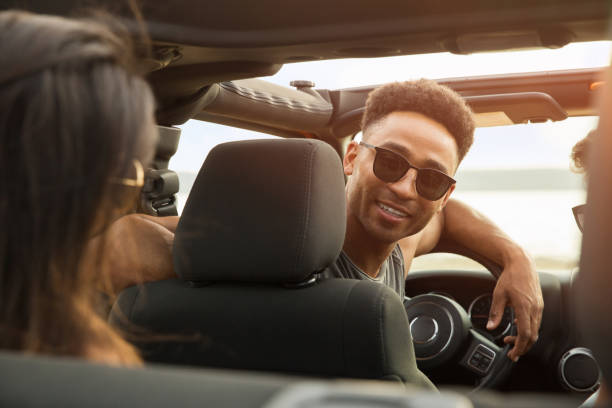 istock Smiling young african man having fun with his friends 1371996227