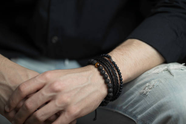 istock young man with a stylish bracelet on his wrist 1371996271