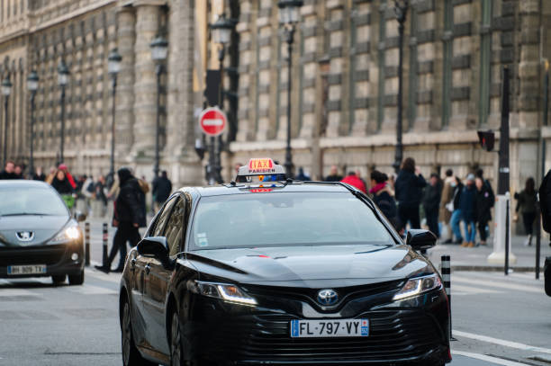 Paris, France - 13 February 2022: A Toyota Camry taxi car on Rivoli street in Paris, France