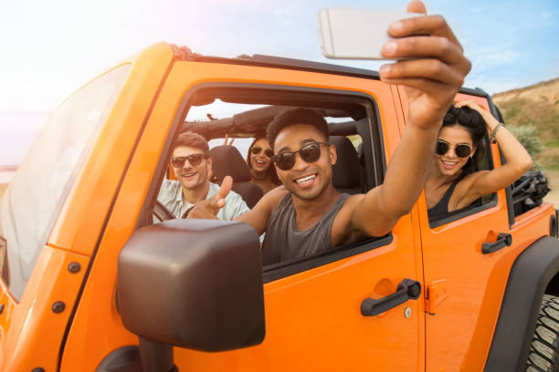 istock Group of happy young friends taking a selfie 1371997049