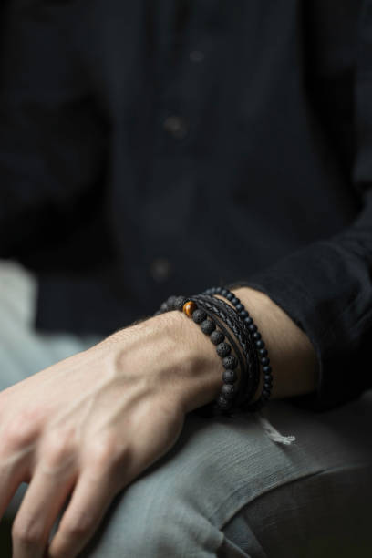 istock young man with a stylish bracelet on his wrist 1371997158
