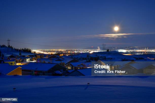 Early Morning Blue Hour Winter View From A Suburban Hillside Subdivision Overlooking The Spokane Valley In The State Of Washington Covered In Snow Stock Photo - Download Image Now