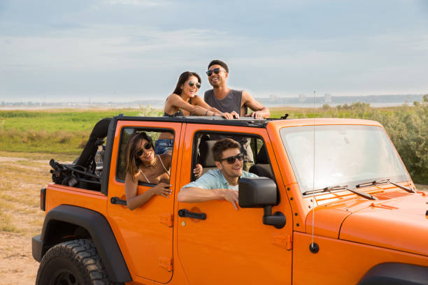 istock Cheerful people having fun be travelling together by a car 1371997563