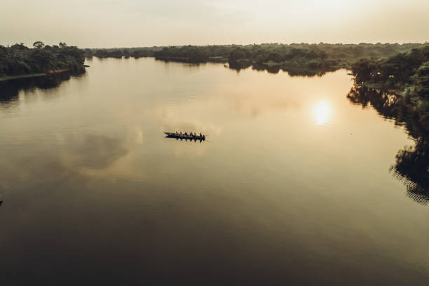 istock Sunset on the Amazon river. Boat with people on the water 1372001104