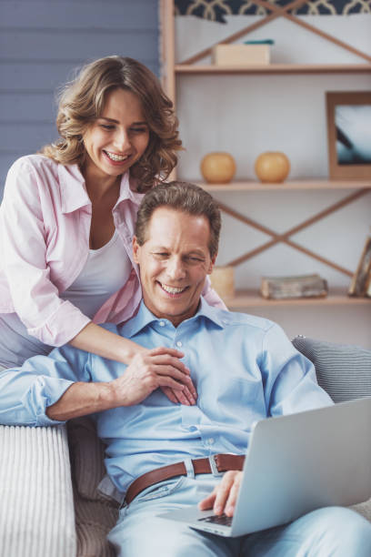 istock Beautiful couple with gadget 1372001407