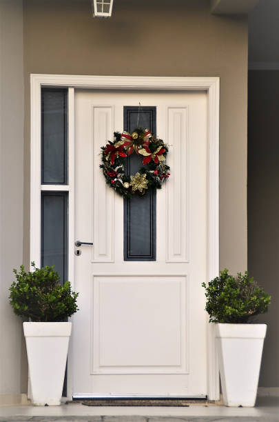 istock A white door with Christmas garland 1372004009