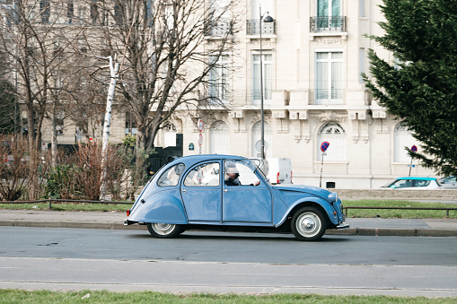 Old french car in motion in Paris