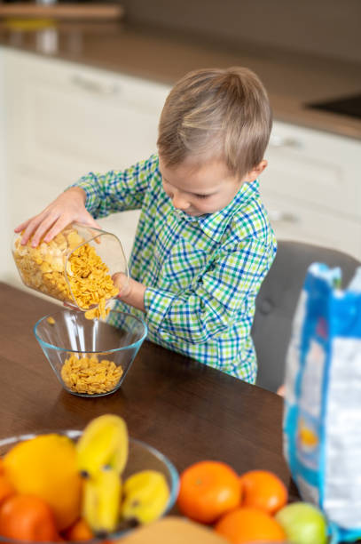 istock Kid preparing a cold oatmeal dish for breakfast 1372007718