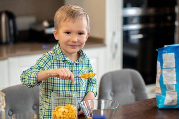 istock Kid posing for the camera during his morning meal 1372007725