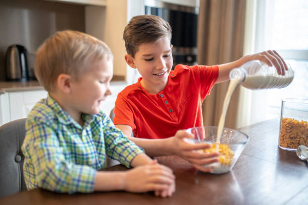 istock Pleased boy preparing a cold oatmeal dish for breakfast 1372007744
