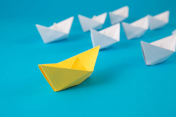 istock Leadership Concept with Paper Boats 1372008154